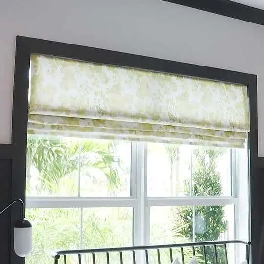 Luxurious Roman blinds with elegant fabric folds, adding warmth and sophistication to a stylish interior