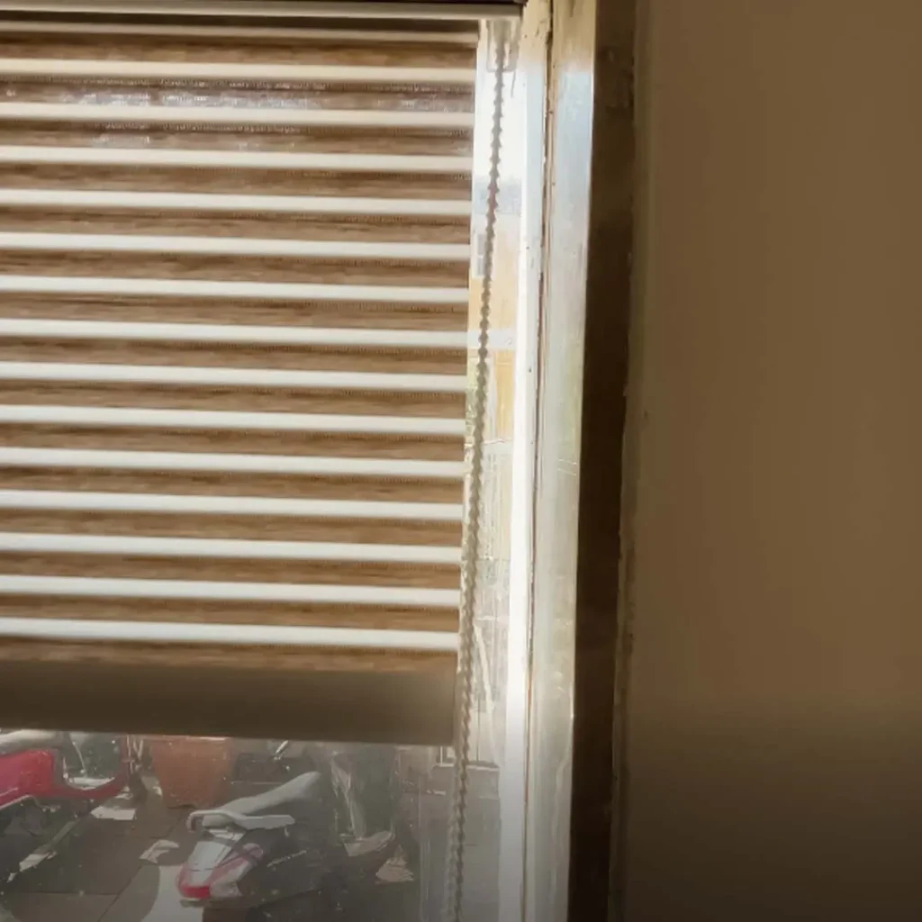 Half-sheer blinds installed at Candolim Grand Inn hotel room in Goa