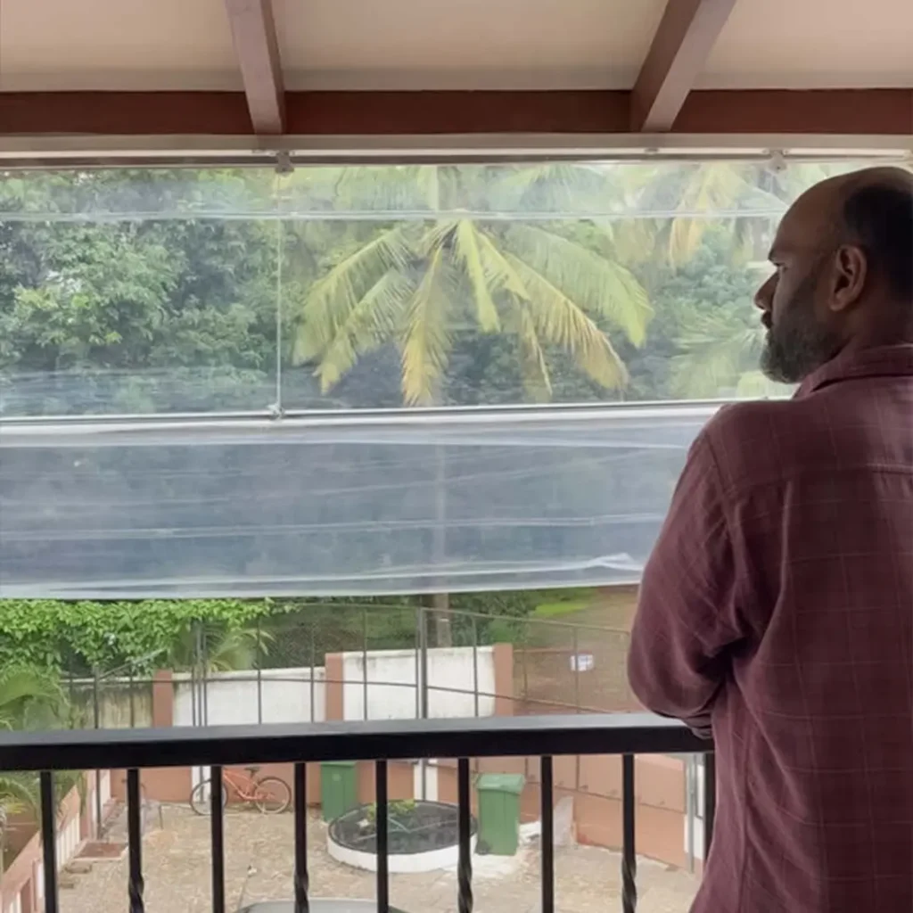 Salman Azam adjusting monsoon blind during terrace installation at Candolim for S.N Interiors Goa