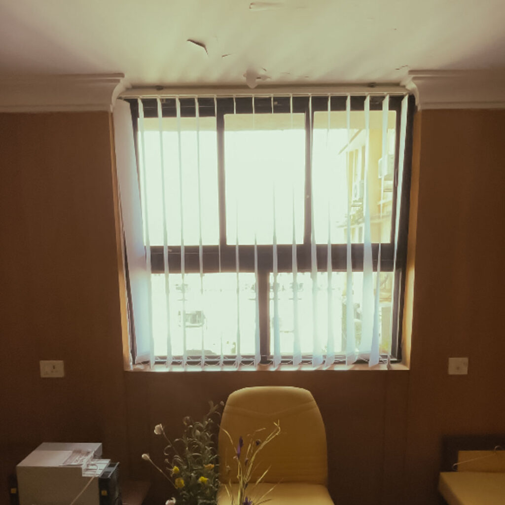 Open vertical blinds at GIDC Goa showing clear outside view.