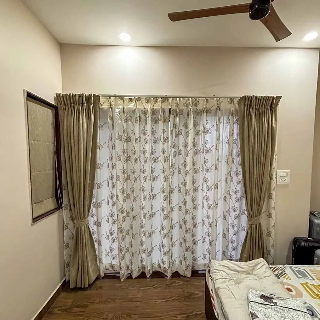 Main and sheer curtains installed at Amora by S.N Interiors Goa – stylish layered window design