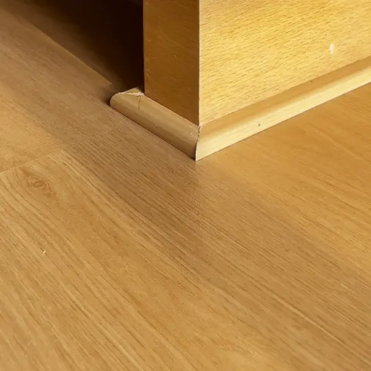 Close-up view of SPC flooring texture by SN Interiors in Goa – durable and stylish flooring solution