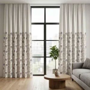 Modern white curtains with a purple and grey floral border installed by SN Interiors Goa.