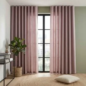 Solid mauve Malta collection curtains professionally installed by SN Interiors Goa.