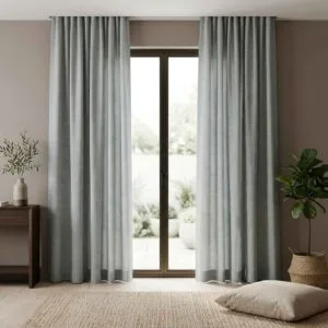 Solid earthy neutral linen curtains from the Malta collection installed by SN Interiors Goa.