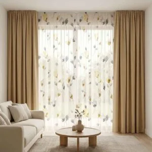 Premium beige blackout curtains and floral sheer drapes professionally installed by SN Interiors Goa in a minimalist living room.