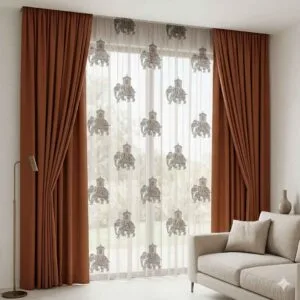 Premium rust-colored blackout curtains and elephant-patterned sheers professionally installed by SN Interiors Goa.