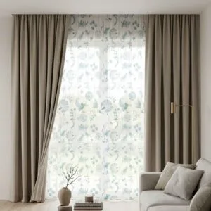 Premium greige blackout curtains and teal floral sheers professionally installed by SN Interiors Goa in a contemporary living room