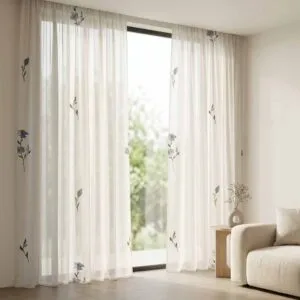 Contemporary white sheer curtains with minimalist blue floral patterns professionally installed by SN Interiors Goa.